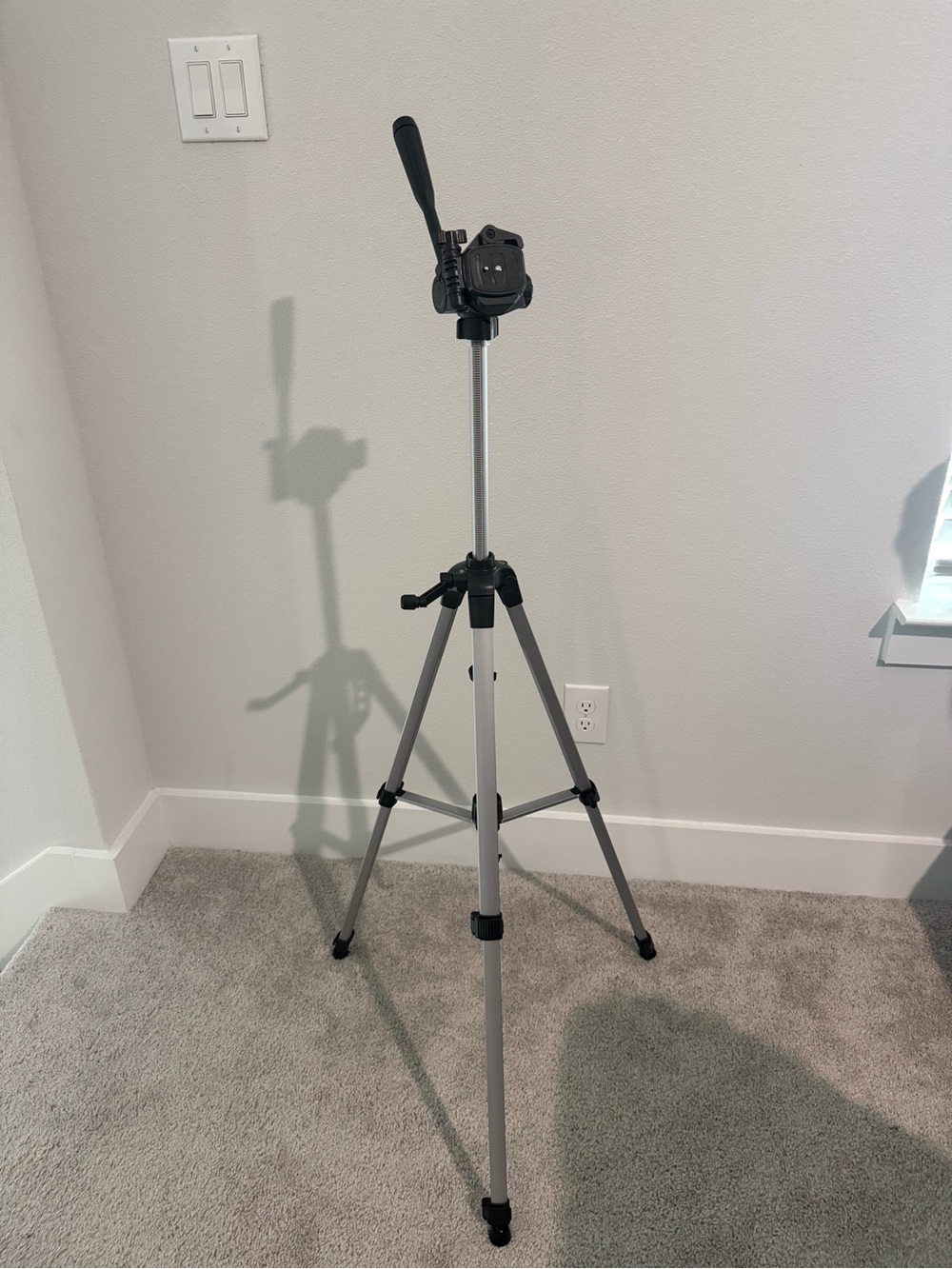 Silver and Black Camera Tripod with Fluid 3‑Way Head